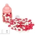 Babyflasche mit Schokolade Dragees rosa und weiß